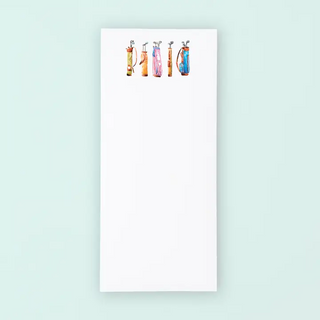 Notepad with colorful illustrations of bottles on a light blue background