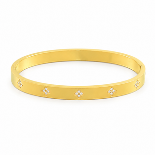 A gold bangle bracelet with five small diamond-like floral accents spaced evenly around the band, shown on a plain white background.