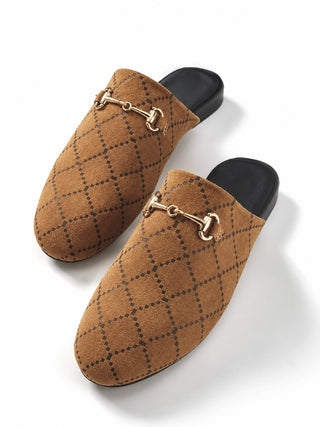 A pair of brown suede mule loafers with a black diamond lattice pattern and a gold horsebit detail on the upper, shown on a white background.