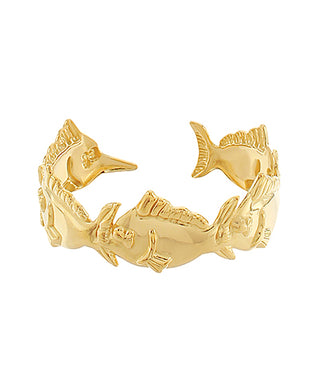 Gold ring with dolphin design on a white background