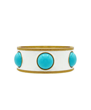 White cuff bracelet with turquoise stones and gold accents on a white background