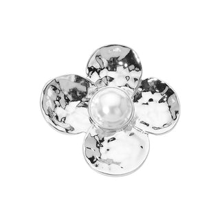A silver flower-shaped dish with a hammered texture and a smooth, glossy white pearl-like center, shown on a plain white background.