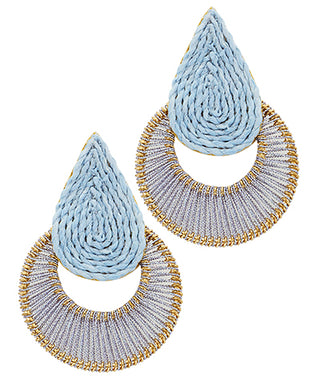 Pair of earrings with blue teardrop shapes and gold circular designs on a white background