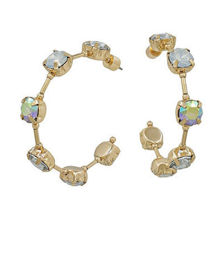 Gold earrings with gemstones on a white background