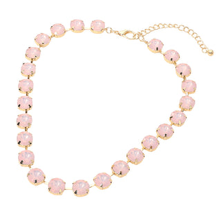 A gold-tone chain necklace featuring a series of round, light pink faceted gemstones, displayed on a clean white background.
