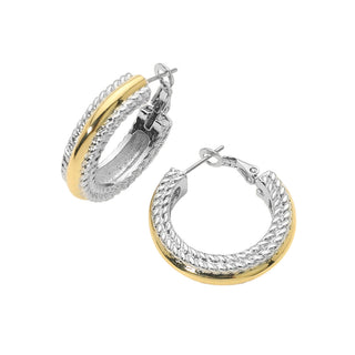 A pair of silver-tone hoop earrings with a textured outer band and a polished yellow-gold inner band, shown on a plain white background.