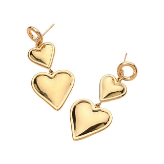 A pair of gold-plated drop earrings featuring three heart-shaped charms of varying sizes, displayed on a clean white background.