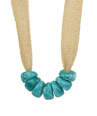 Necklace with turquoise beads on a beige background