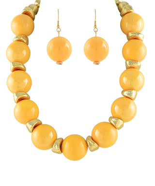 A matching jewelry set featuring a beaded necklace and drop earrings. The set consists of matte orange-yellow round beads separated by small textured metallic gold spacer beads, with two matching drop earrings shown above.
