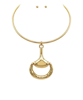 Gold necklace with a unique pendant on a white background