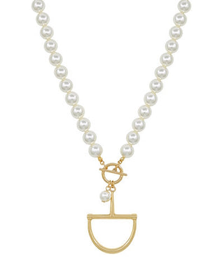 Pearl necklace with a gold pendant on a white background