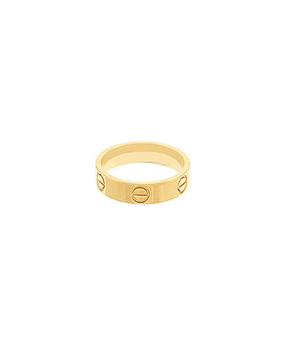 Gold ring with engraved symbols on a white background