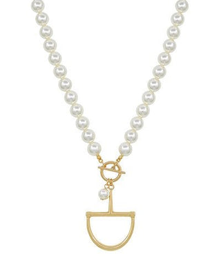 Pearl necklace with a gold pendant on a white background
