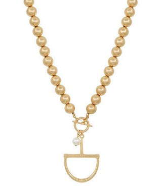 Pearl necklace with a gold pendant on a white background