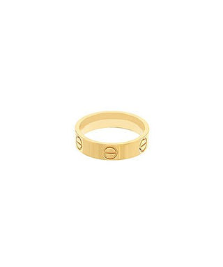 Gold ring with engraved symbols on a white background